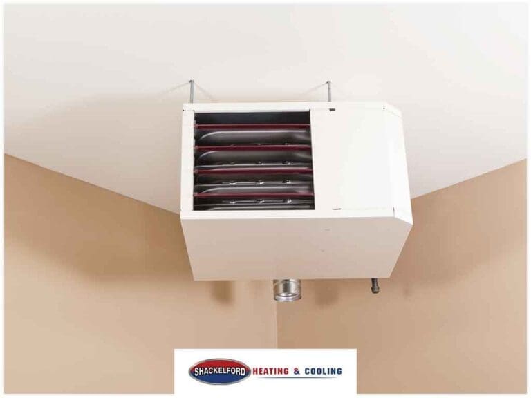 A garage heating system in the corner attached to the the ceiling