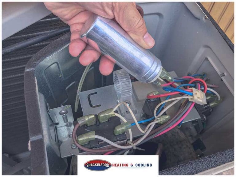 A technician working on an AC unit for your home