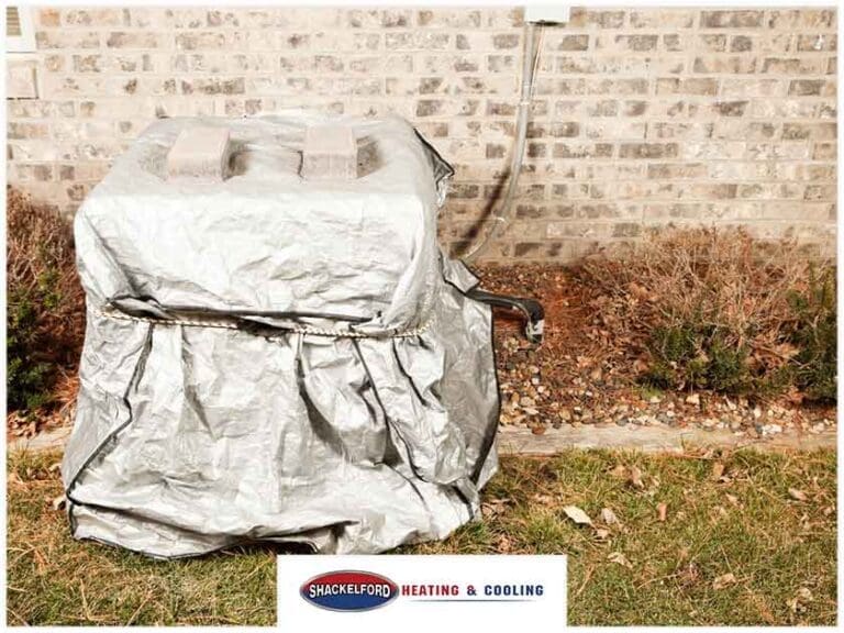 An AC unit with a cover over it