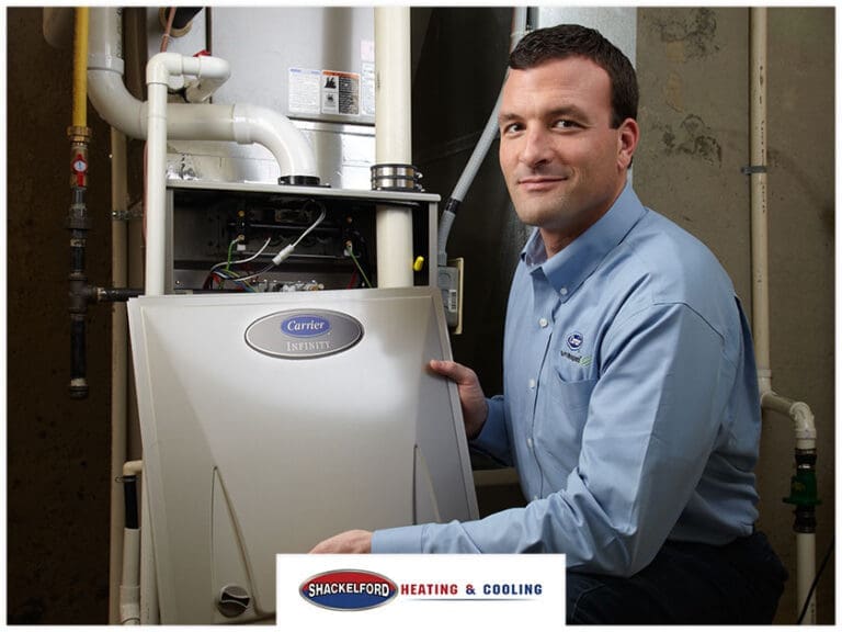 A man installing a new air conditioner in a home