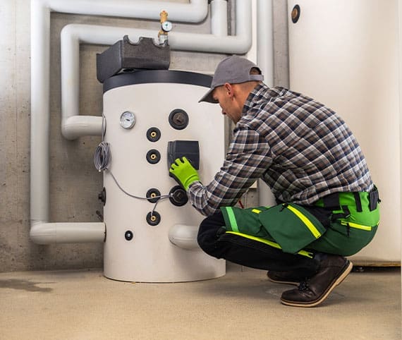 HVAC Tech inspecting a boiler