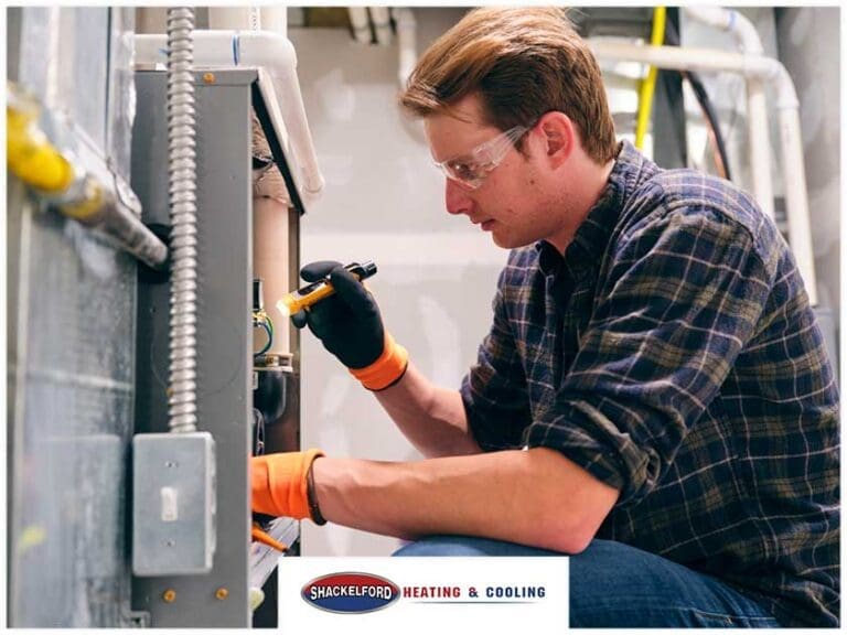 A technician working on an HVAC system