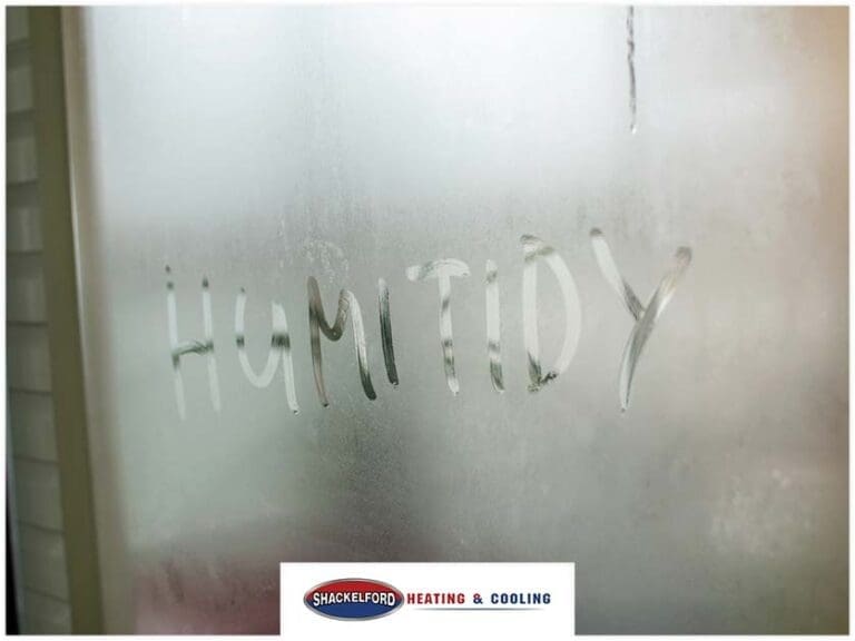 A window fogged over with HUMITIDY written into it