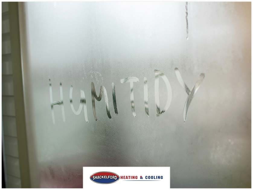A window fogged over with HUMITIDY written into it