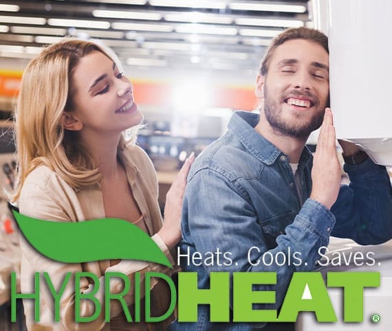 Couple smiling looking at Hybrid Heating systems.