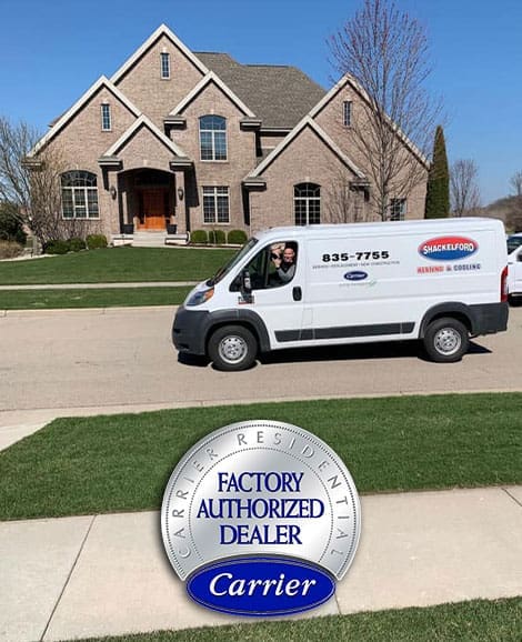 Shackelford service van driving down the street with Factory Authorized Dealer badge at the bottom