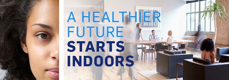 People working in an office space with text overlay saying A Healthier Future Starts Indoors