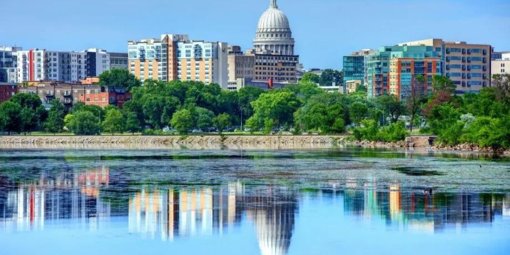 A picture looking over the lake to downtown Madison in the hot summer.