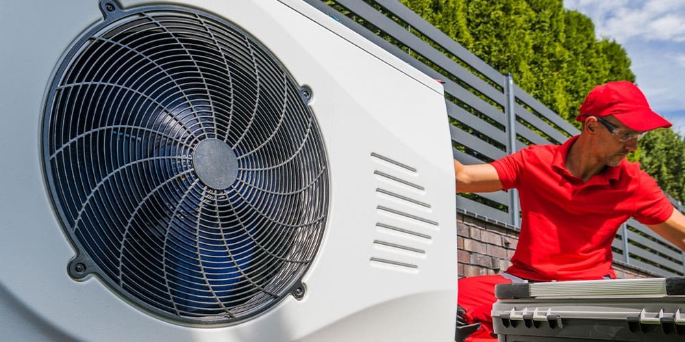 Technician installing a new Heat Pump